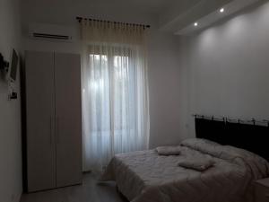 Postel nebo postele na pokoji v ubytování Rosa del Salento