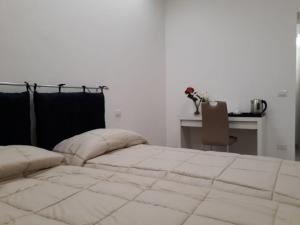 Postel nebo postele na pokoji v ubytování Rosa del Salento