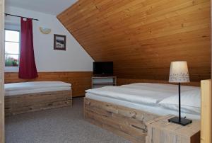 Ένα ή περισσότερα κρεβάτια σε δωμάτιο στο Penzion Čistá