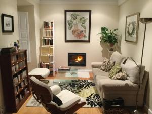 a living room with a couch and a fireplace at Villa Elena in Potes