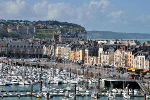 a bunch of boats are docked in a harbor at Le studio d'Evelyne in Dieppe