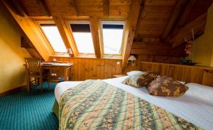 Postel nebo postele na pokoji v ubytování Lautaret Lodge & Spa