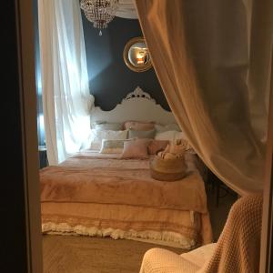 Postel nebo postele na pokoji v ubytování La dimora del Casanova B&B boutique + 29 fotografií