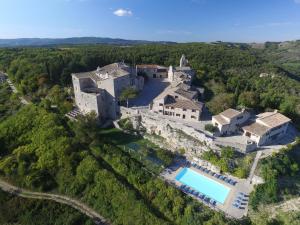 an aerial view of a large house with a swimming pool at Castello di Titignano in Orvieto