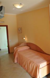 Postel nebo postele na pokoji v ubytování Hotel Vittoria