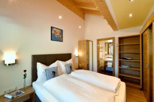 Postel nebo postele na pokoji v ubytování Hotel Garni Bergwelt