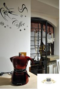 a red coffee maker on a counter in a kitchen at Villa Antinea in Avellino