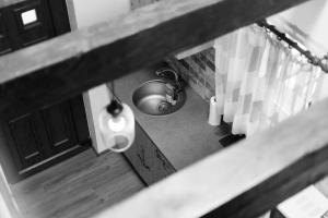 an overhead view of a kitchen with a sink at Casa Gozna in Văliug +42 photos