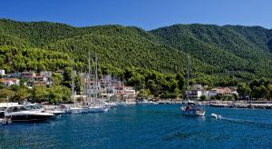 a group of boats docked in a harbor at Alexios Studios in Neo Klima