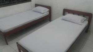 Katil atau katil-katil dalam bilik di Penginapan Kofiyau
