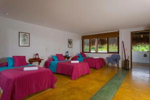 Ένα ή περισσότερα κρεβάτια σε δωμάτιο στο Hotel Cinaruco Caney