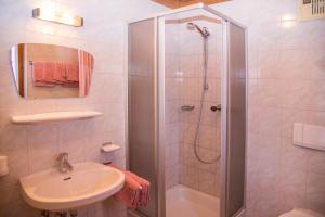 a bathroom with a shower and a sink at Apart Romantica in Kappl