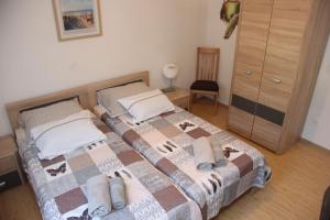Łóżko lub łóżka w pokoju w obiekcie Vacation house "Viola"