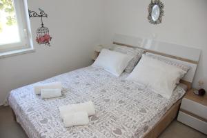 Łóżko lub łóżka w pokoju w obiekcie Vacation house "Viola"