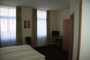 Postel nebo postele na pokoji v ubytování Hotel Wettin