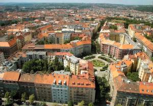 an aerial view of a city with orange roofs at LOVELY Prague Apartment in Prague