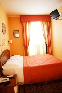Postel nebo postele na pokoji v ubytování Greta Rooms Hotel