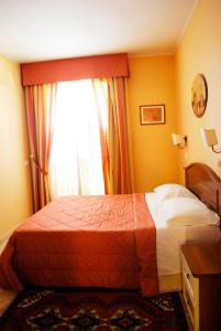 Postel nebo postele na pokoji v ubytování Greta Rooms Hotel
