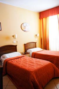 Postel nebo postele na pokoji v ubytování Greta Rooms Hotel