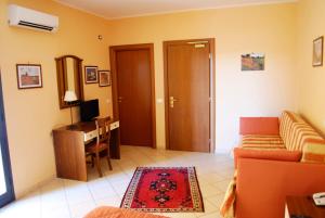 TV a/nebo společenská místnost v ubytování Greta Rooms Hotel