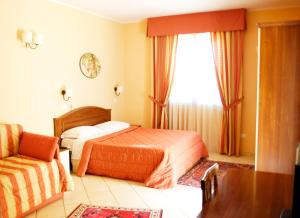Postel nebo postele na pokoji v ubytování Greta Rooms Hotel