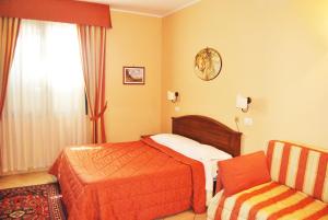 Postel nebo postele na pokoji v ubytování Greta Rooms Hotel