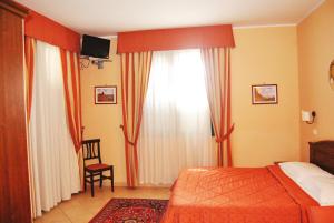 Postel nebo postele na pokoji v ubytování Greta Rooms Hotel