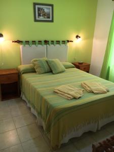 Tempat tidur dalam kamar di Sueno Verde Colón