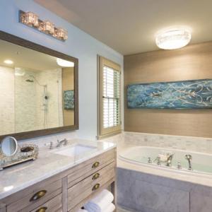 a bathroom with a tub and a large mirror at Bernardus Lodge & Spa in Carmel Valley