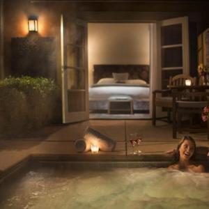 a woman in a bath tub next to a fire hydrant at Bernardus Lodge & Spa in Carmel Valley