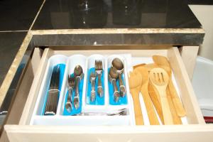 a drawer filled with utensils in a kitchen at Casa De Pedro in Mangilao