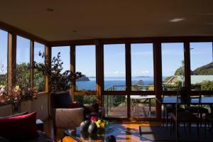 a living room with a view of the ocean at Sails Ashore Lodge in Half-moon Bay