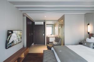 Posteľ alebo postele v izbe v ubytovaní Marine Beach Hotel Pattaya - SHA Plus