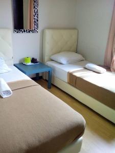 سرير أو أسرّة في غرفة في Selesa View Gambang
