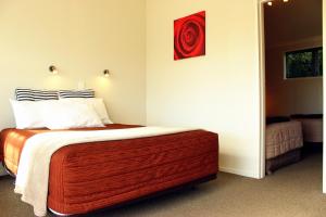 Postel nebo postele na pokoji v ubytování Te Awa Motel