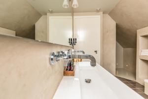 Koupelna v ubytování De Herberg Appartementen