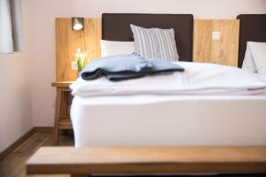 Rúm í herbergi á Hotel Moserwirt