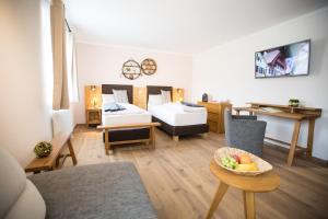 Rúm í herbergi á Hotel Moserwirt