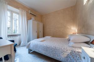 Katil atau katil-katil dalam bilik di ROME HOUSE Lotto29 a Quiet Home in Garbatella an amazing neighborhood
