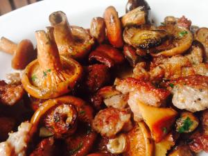 a white plate of food with shrimp and mushrooms at Can Barrina in Montseny