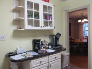 a kitchen with white cabinets and a counter top at 2 Blks St Marys 2 Main Fl Beds Bath CoveredByFaith in Rochester