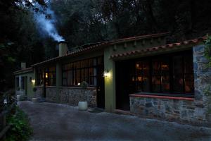 a house at night with a lit up at Can Barrina in Montseny