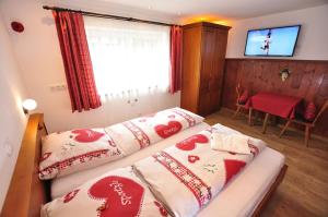 Postel nebo postele na pokoji v ubytování Hotel Anneliese