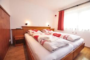 Postel nebo postele na pokoji v ubytování Hotel Anneliese