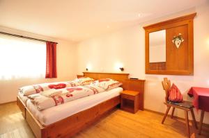 Postel nebo postele na pokoji v ubytování Hotel Anneliese