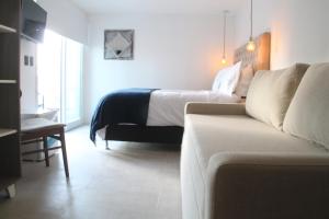 Cama ou camas em um quarto em Hotel Florinda