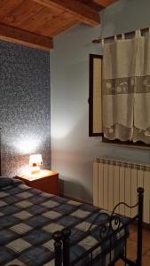 Postel nebo postele na pokoji v ubytování Pineta Monserrato