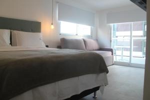 Cama ou camas em um quarto em Hotel Florinda