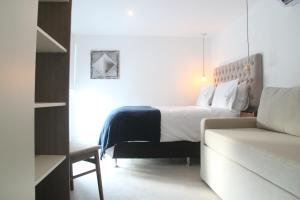 Cama ou camas em um quarto em Hotel Florinda