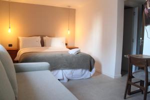 Cama ou camas em um quarto em Hotel Florinda